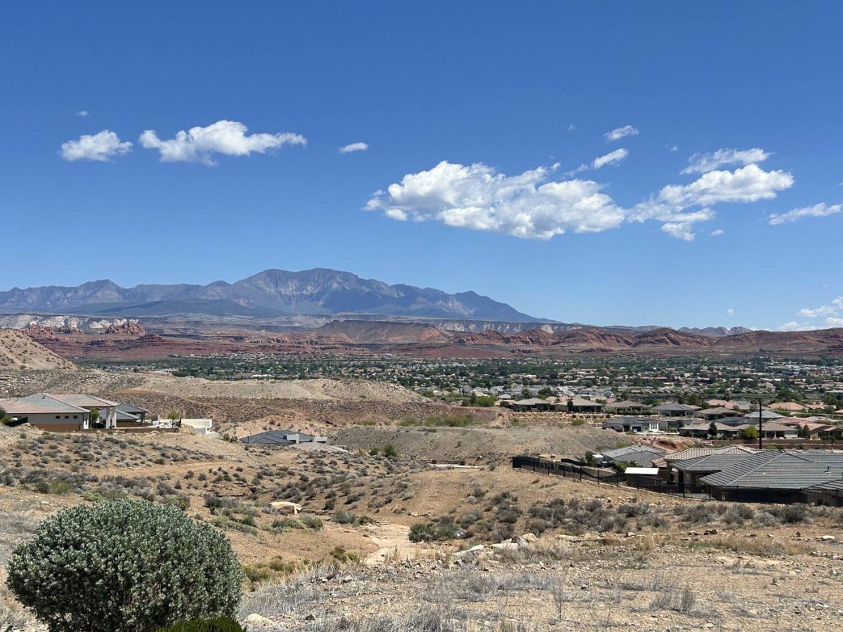 The St. George valley with red rock cliffs and Pine Valley Mountain beyond